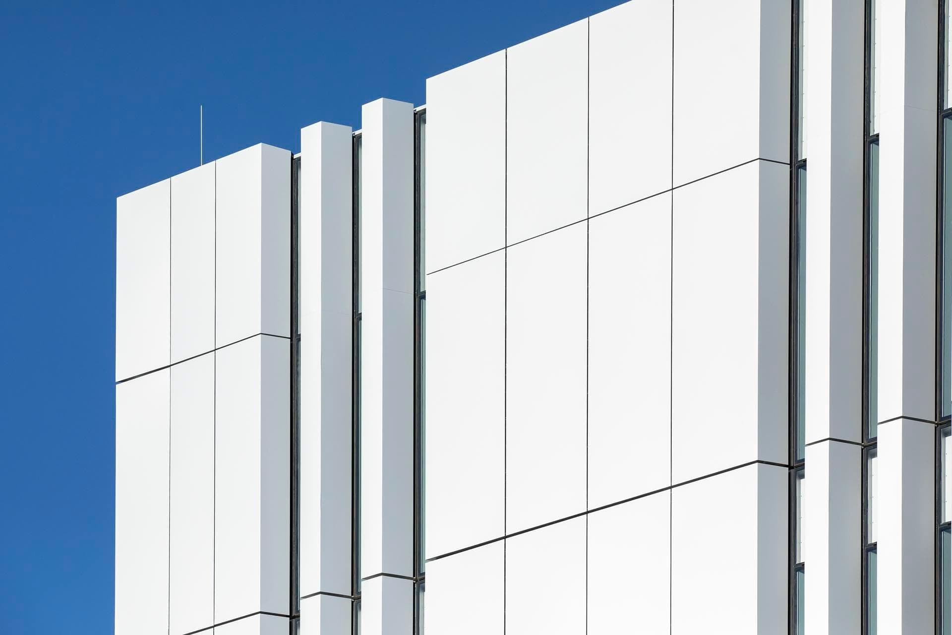 White Alpolic NC façade panels on the Charles Perkins Centre, highlighting the sleek vertical lines and modern architectural design.