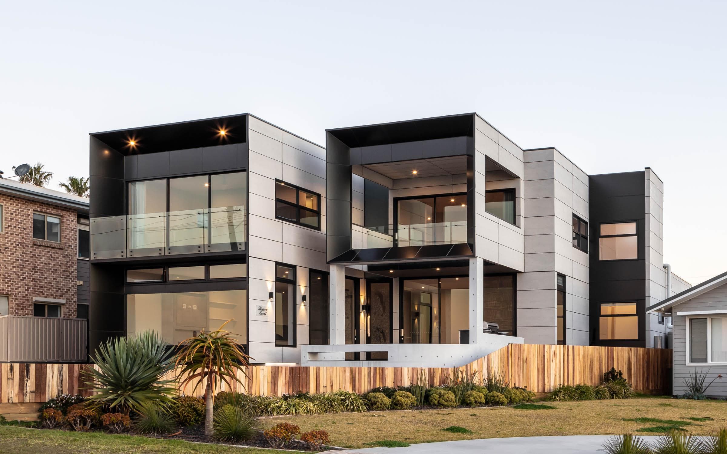 Dusk exterior of The Icon showcasing illuminated façade with ALPOLIC™/fr cladding